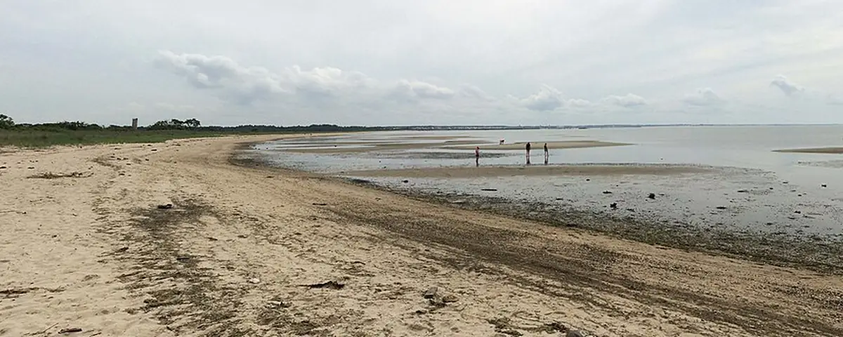 Delaware: The Delaware Breakwater Lighthouse is evident in the photo as are a few unrecognizable people.