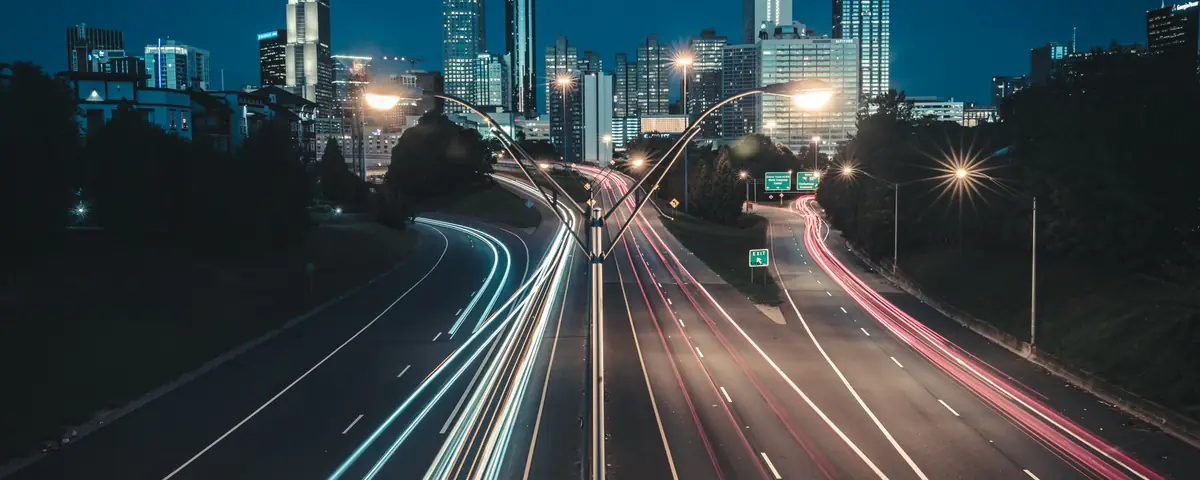 Georgia: An image of the Atlanta, Georgia Skyline taken at dawn with long exposure to create light trails of the morning traffic. Taken from the Jack